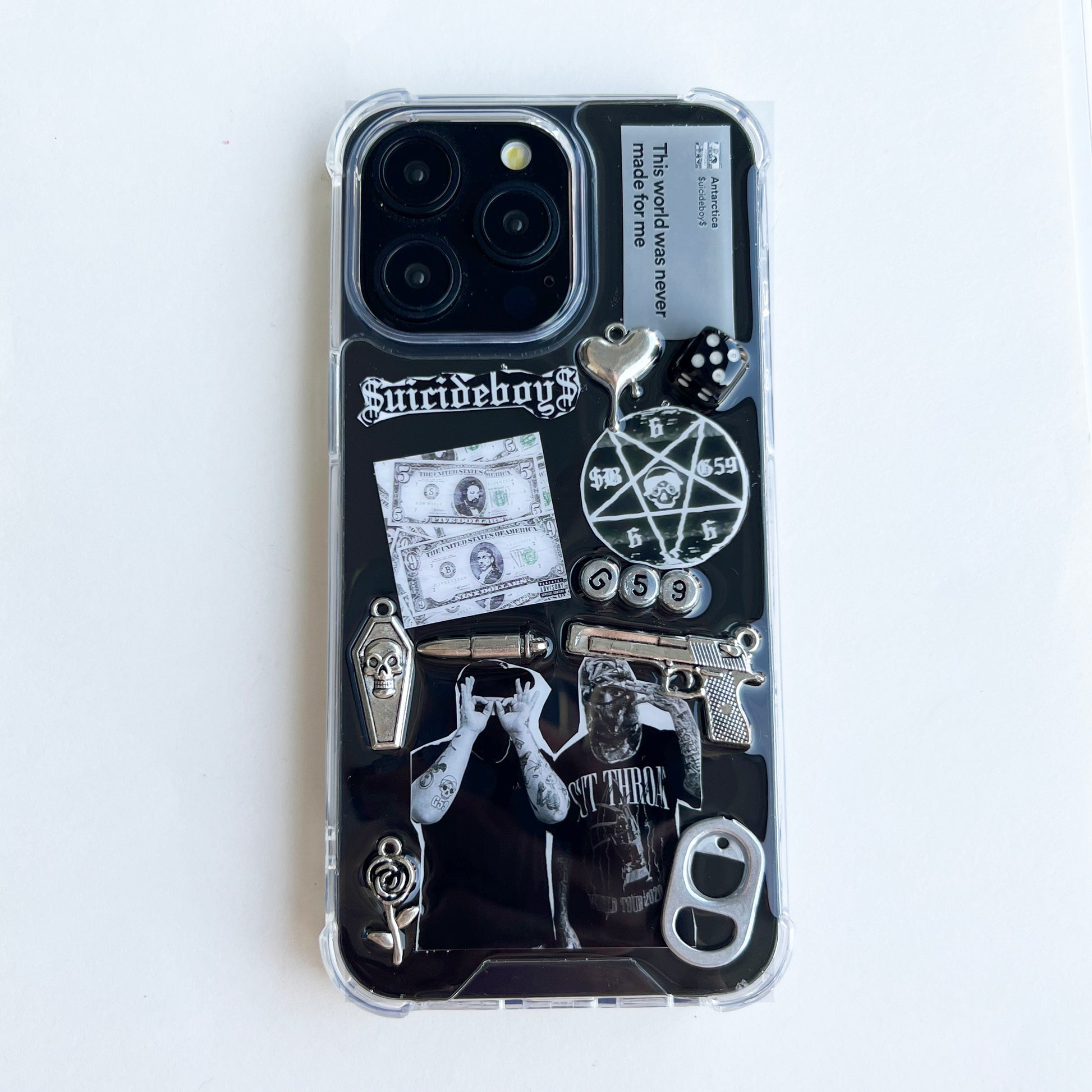 custom suicideboys $uicideboy$ Phone case decorated with Suicideboys band merchandise graphics, including a black-and-white graphic print, a pentagram, a skull, a revolver, a dollar bill, dice, and gothic text, shown on a plain white background.